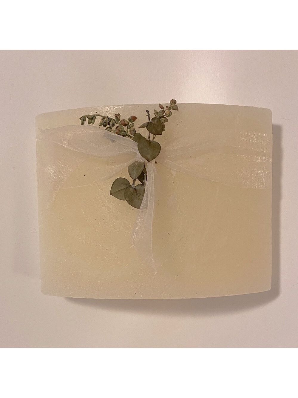 Chic Cream Candle with Sheer Ribbon and Greenery